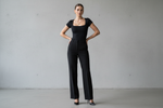 Load image into Gallery viewer, stylish woman wearing black Square Neck Short Sleeve Bodysuit
